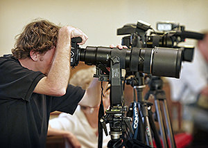 Assistant photographers in church balcony